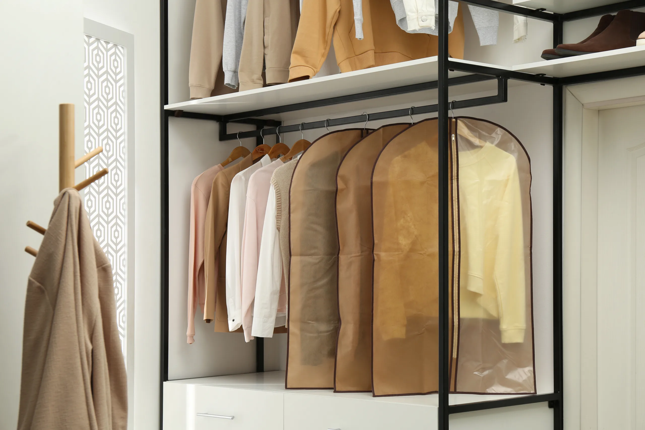 A closet of hanging garments